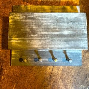 Wooden key hanger with storage in top.